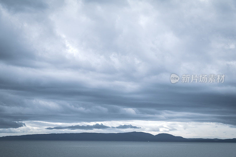 Moody Cloudscape Over The Ocean